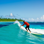 마셜 제도 서핑 스팟 - **

"A professional photographer, fully clothed in appropriate hiking gear, capturing a surfer ridin...